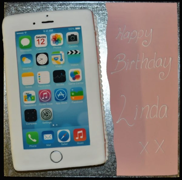 Modern iPhone shaped cake with realistic details, perfect for tech lovers or special occasions. Ideal for those who appreciate technology and innovation.