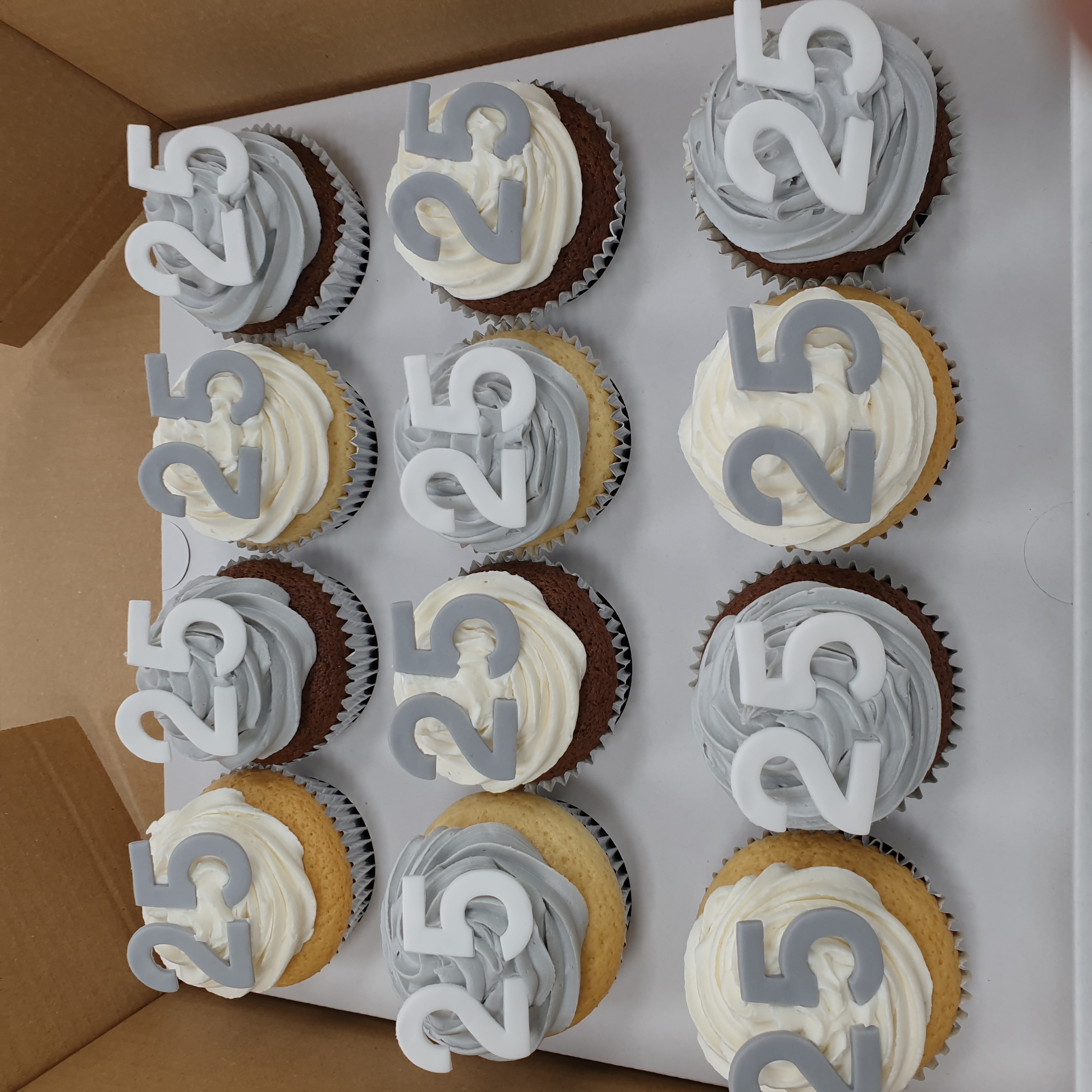 Bespoke Number Cupcakes arranged in Solihull, West Midlands for a celebration with colorful icing and sprinkles.