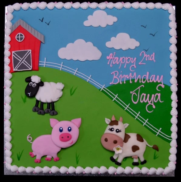 A whimsical and charming cartoon farm animals scene depicted on a cake, perfect for themed celebrations and children's parties.