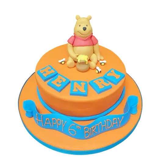 Bespoke Winnie The Pooh celebration cake with detailed fondant characters in Solihull, West Midlands.