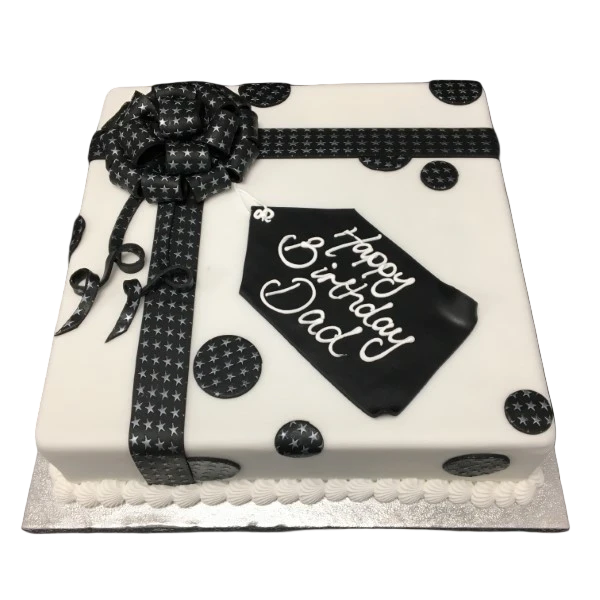 Bespoke parcel-shaped cake with shimmer stars decoration, crafted for celebration in Solihull, West Midlands.