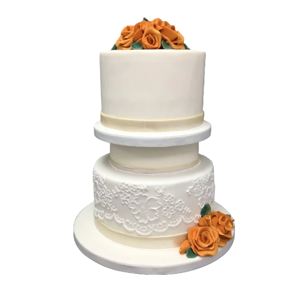 Three-tier white wedding cake with orange sugar paste roses and lace details.