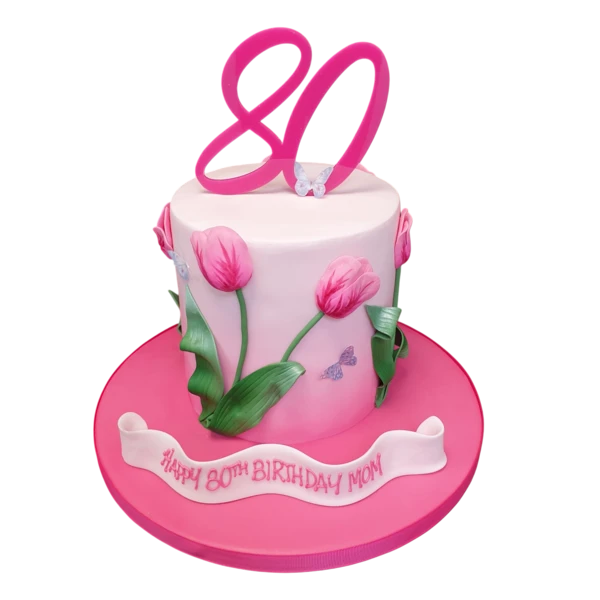 Bespoke celebration cake decorated with vibrant tulip flowers, crafted in Solihull, West Midlands.
