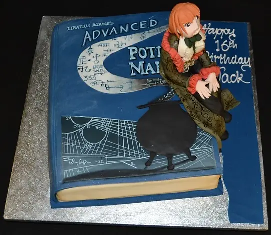 Bespoke Harry Potter magic book cake with detailed figure, perfect for celebration in Solihull, West Midlands.