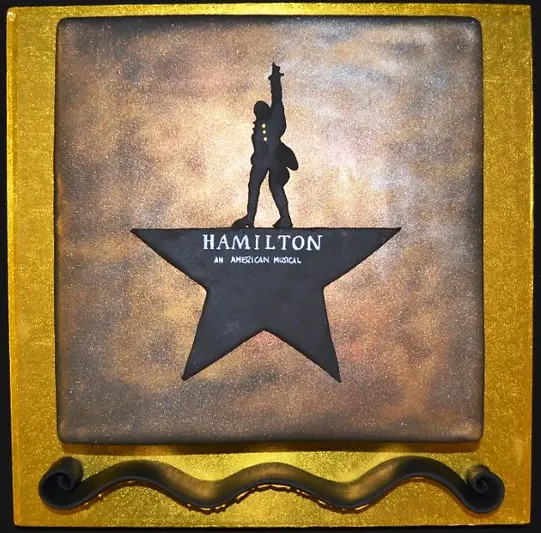 Bespoke square cake featuring the Hamilton musical logo, crafted for a celebration in Solihull, West Midlands.