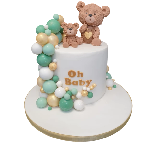 Bespoke celebration cake with "Oh Baby" topper, teddy bears, and colorful balls in Solihull, West Midlands.