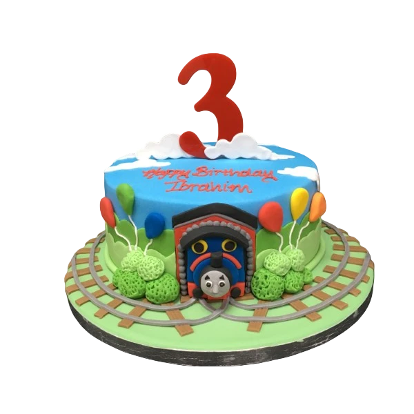 Bespoke Thomas The Tank Engine cake with vibrant blue icing and detailed train features in Solihull, West Midlands.