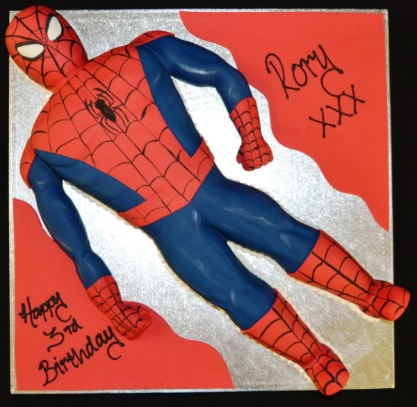 Bespoke Spiderman cake with red and blue web design, featuring Spiderman figure, in Solihull, West Midlands.