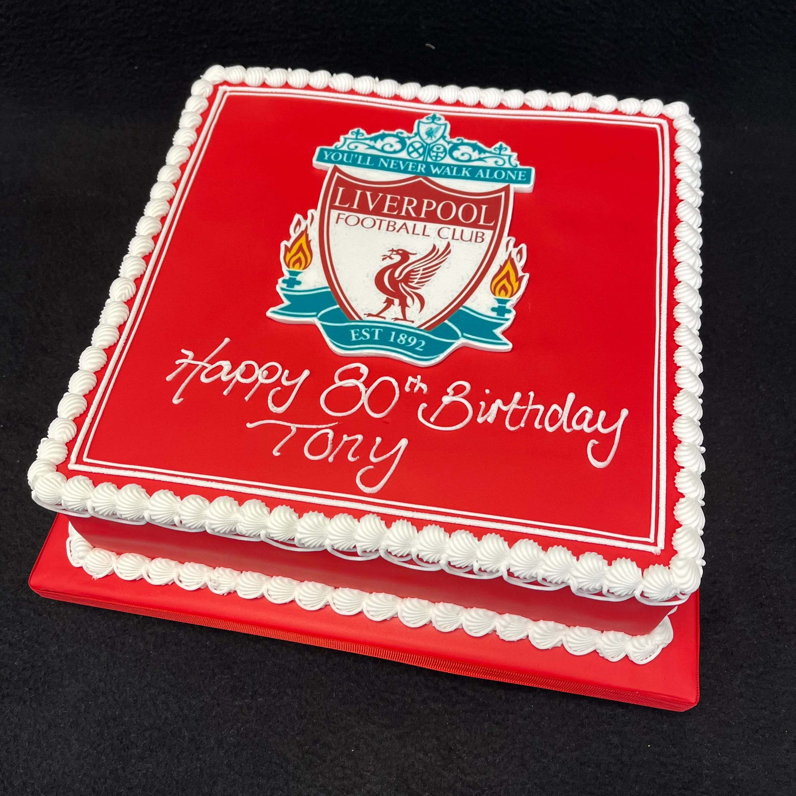 Bespoke Liverpool badge cake with detailed red and white icing, crafted for celebration in Solihull, West Midlands.