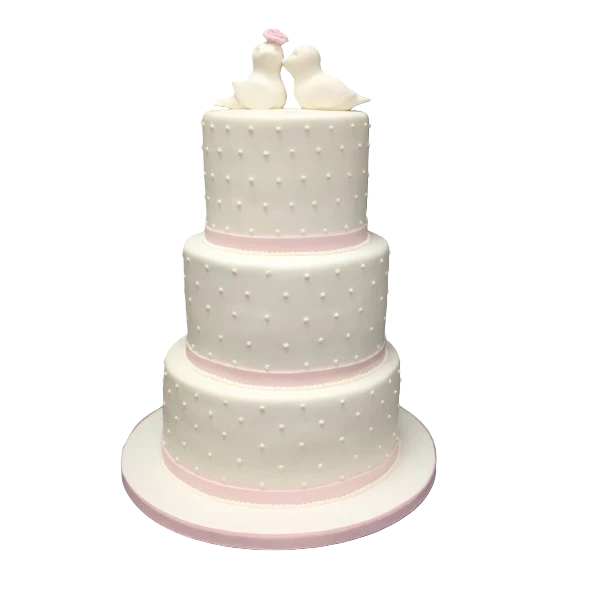 Three-tiered wedding cake with sugar paste pearls, blush ribbons, and lovebird topper.