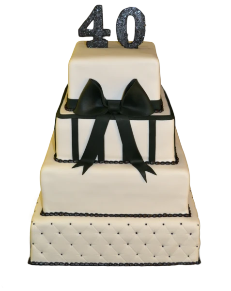 Four-tier black and white wedding cake with a quilted base and black bow.