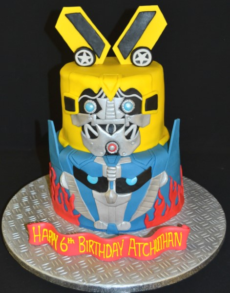 Bespoke Transformers duo cake with detailed robot figures and vibrant colors, crafted in Solihull, West Midlands.