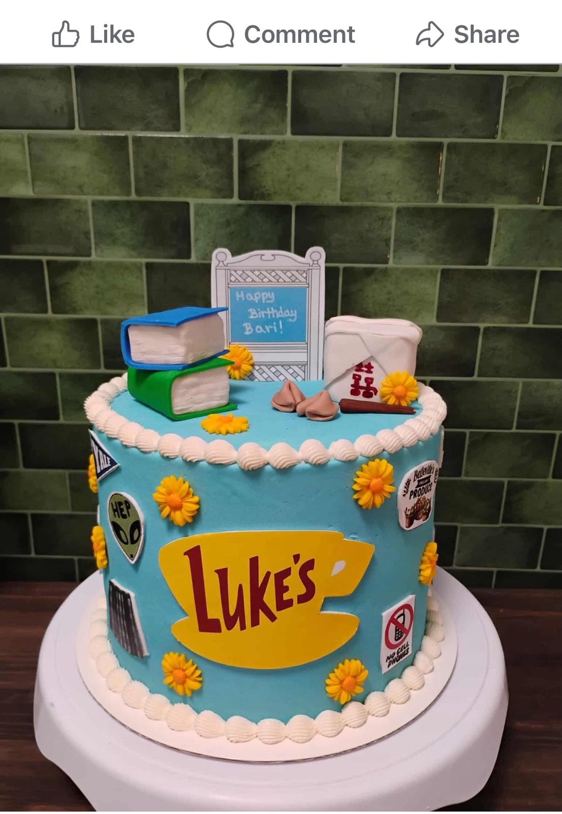 Bespoke celebration cake with intricate floral designs and gold accents in Solihull, West Midlands.