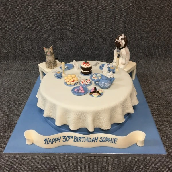 Bespoke Cat & Dog Tea Party cake with fondant animals and tea set decorations in Solihull, West Midlands.