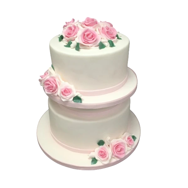 Two-tier white cake with pink sugar paste roses and ribbon decorations.