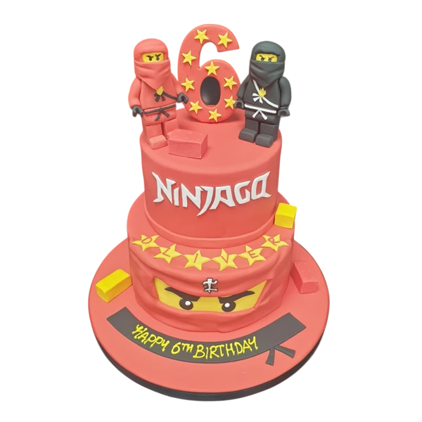 Bespoke Lego Ninjago cake with colorful ninja figures and brick details, crafted for a celebration in Solihull, West Midlands.
