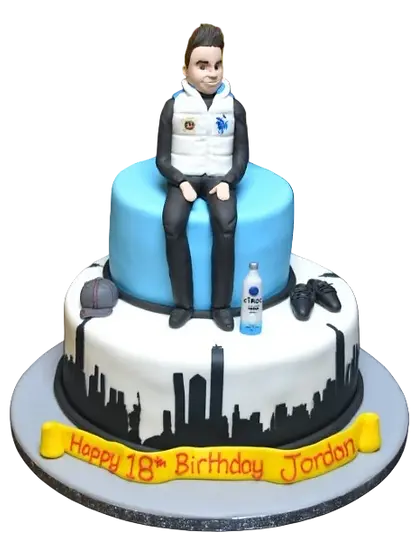 Bespoke tiered cake with NYC skyline and musical notes, perfect for celebration in Solihull, West Midlands.