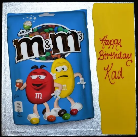 Bespoke M&Ms Crispy celebration cake with colorful candy topping, crafted in Solihull, West Midlands.
