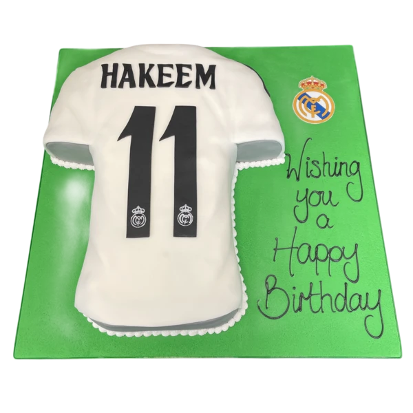 Bespoke Real Madrid football shirt cake with detailed crest and stripes, crafted in Solihull, West Midlands for celebration.