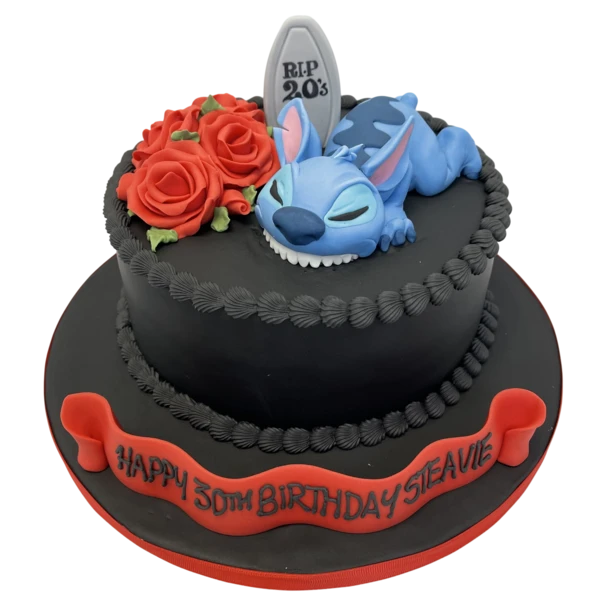 Bespoke Lilo and Stitch celebration cake with vibrant blue and red icing, featuring character toppers in Solihull, West Midlands.
