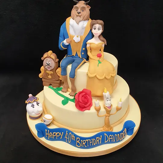 Bespoke Beauty and The Beast themed cake with intricate rose and character details, crafted in Solihull, West Midlands.