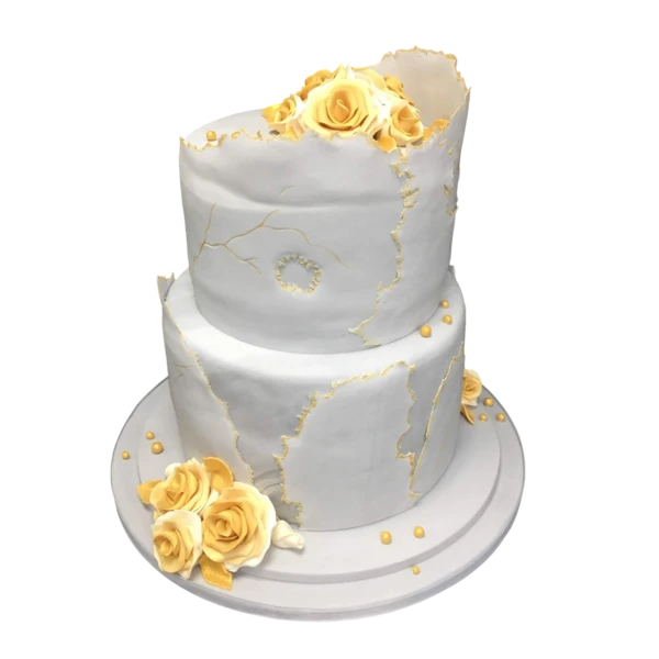 Two-tiered wedding cake with gold veining and golden sugar paste roses.
