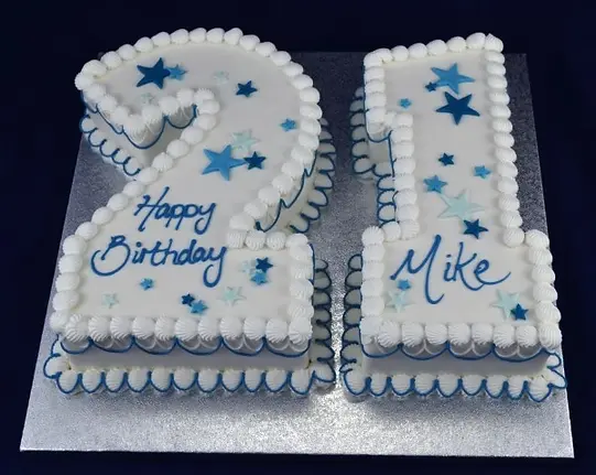 Bespoke cake with 21 silver stars and fig decorations, crafted for celebration in Solihull, West Midlands.