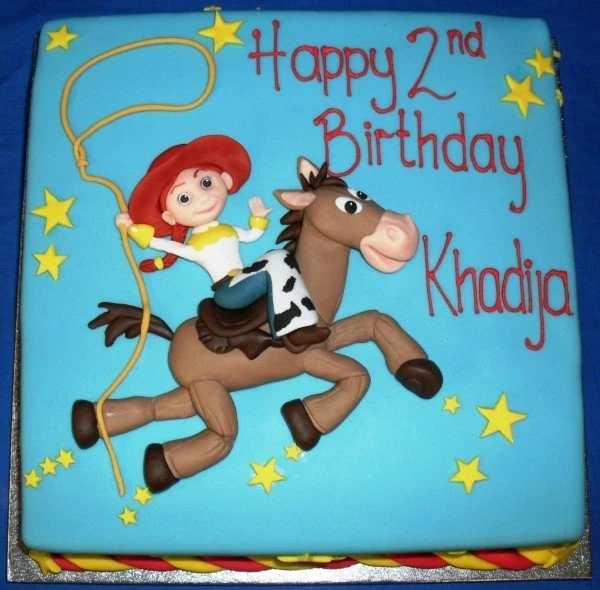 Bespoke Jessie Toy Story square cake with colorful fondant details, perfect for celebration in Solihull, West Midlands.