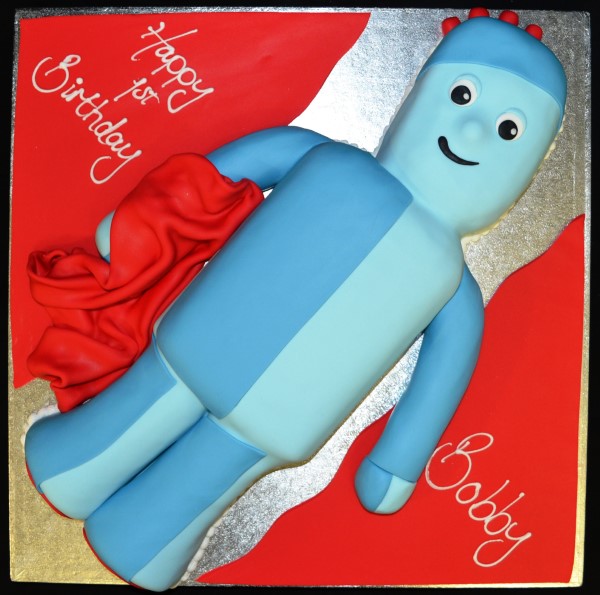 Bespoke Iggle Piggle cake with vibrant colors and night garden theme, crafted in Solihull, West Midlands.