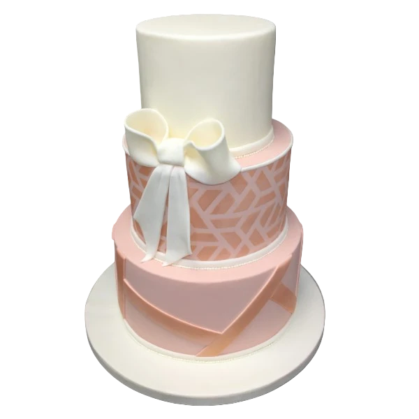 Three-tier wedding cake with ivory and blush colours, geometric pattern, and sugar paste bow.