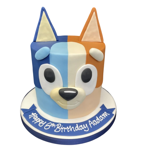 Bespoke Bluey and Bingo themed cake with vibrant colors and character toppers, crafted in Solihull, West Midlands.
