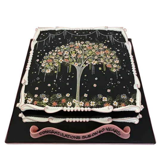 Bespoke cake shaped like a floral gift bag tree with pastel flowers, crafted in Solihull, West Midlands.