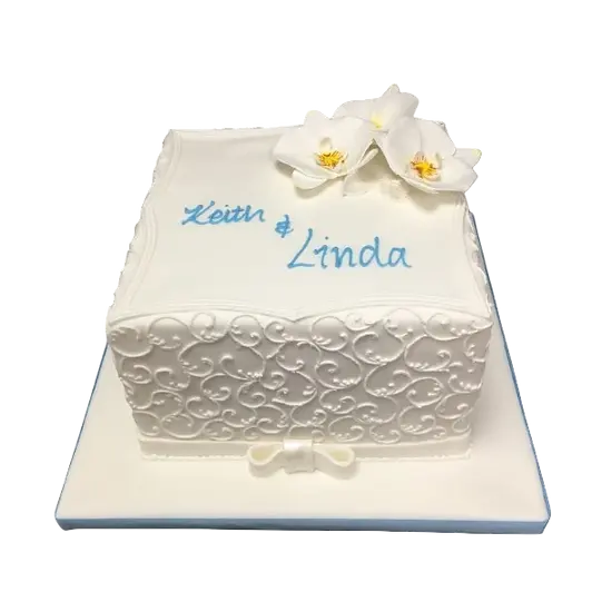 Bespoke filigree square cake adorned with delicate orchids, crafted in Solihull, West Midlands for a celebration.