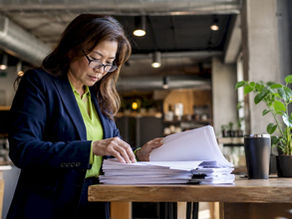 Property manager reviewing compliance documents