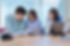 college-students-with-teacher-sitting-at-desk-in-classroom-studying-languages-sciences.jpg