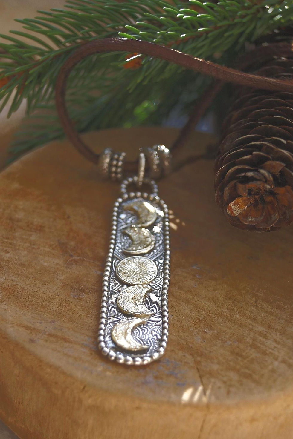 Thumbnail: Sterling and Gold Moon Phases Necklace on Leather Cord