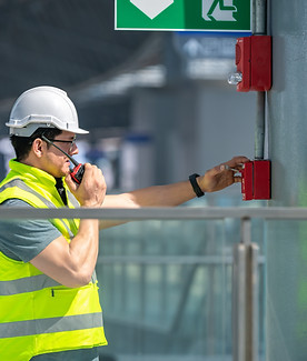 Qualified fire safety consultant evaluating commercial premises emergency exits and compliance