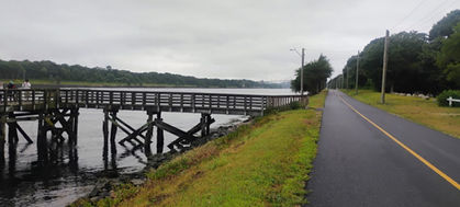 Paved path beside a pedestrian pier and the Cape Cod Canal