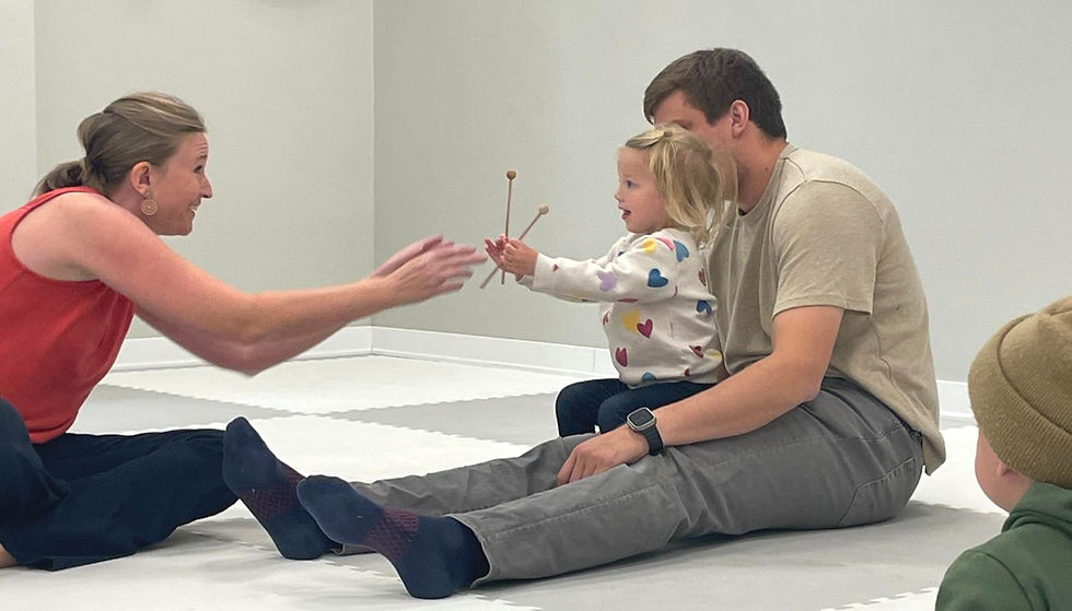 Child Holding Emoji face Cutouts with different Emotions on them.