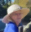 Ingrid Carmean smiles at the camera while wearing a sun hat