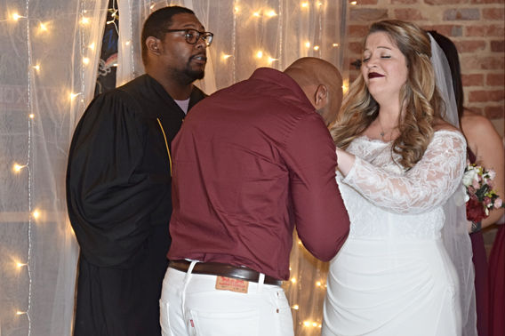 HAPPY GROOM AND BRIDE CRY JOYFULLY AFTER BRIDE PUTS RING ONTO GROOMS FINGER MOMENT.jpg