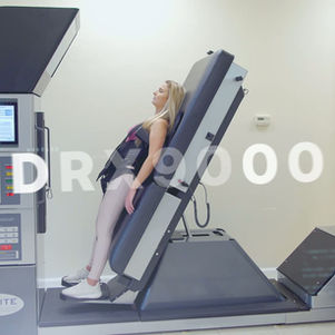 Patient receiving FDA-cleared DRX9000 spinal decompression therapy for herniated disc treatment at Chiropractic Works in Oak Park, Michigan.
