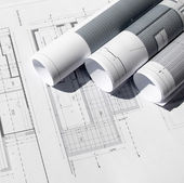 Bouwplannen opgerold