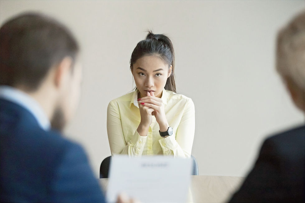 Woman hesitating to speak in a leadership meeting