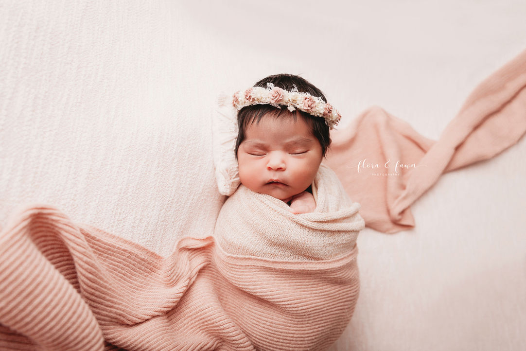 Indoor newborn photography, baby girl sleeping in pink wrap with floral crown headband, Cincinnati Ohio newborn photography, posed, bohemian