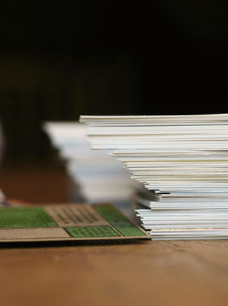 Collector cards on a desk for Card and Ink consignment assessment
