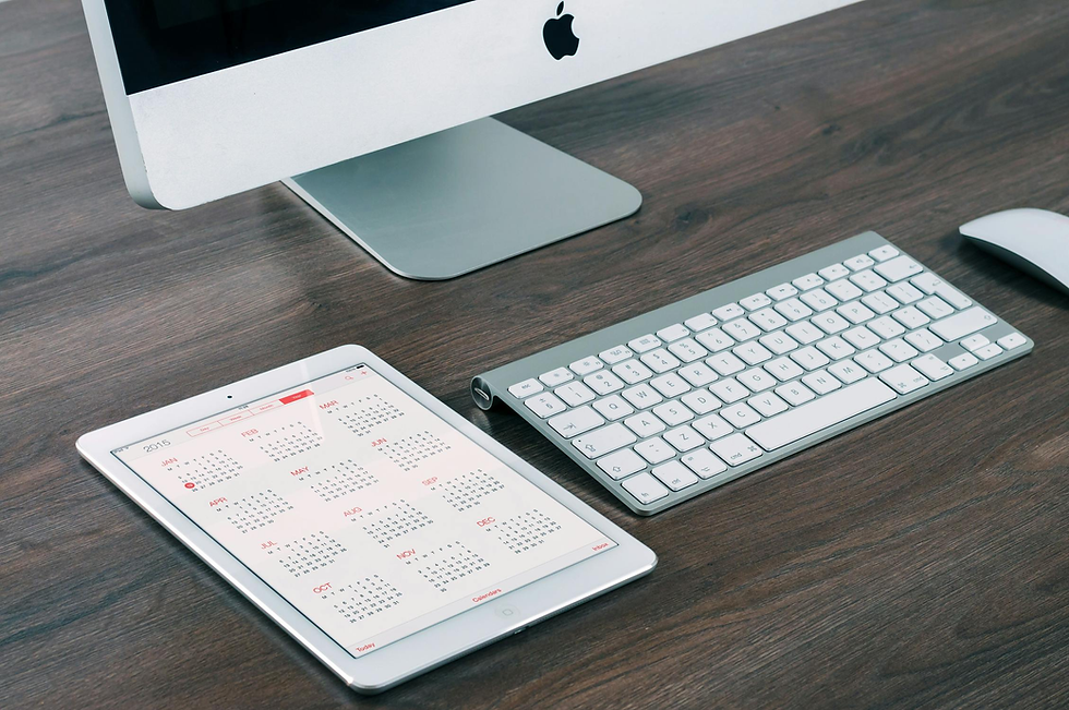Keyboard, mouse, tablet on a desk
