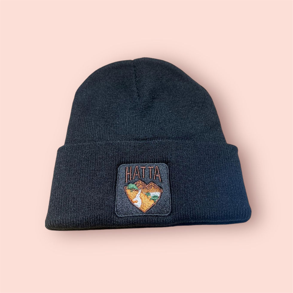 Black winter hat with HATTA mountain logo patch