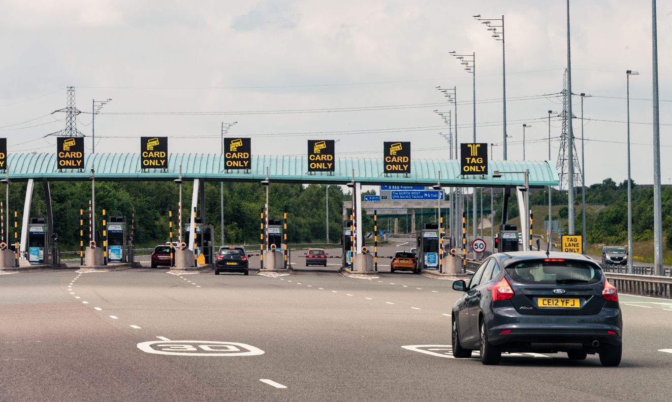 car arriving at a toll booth in the UK