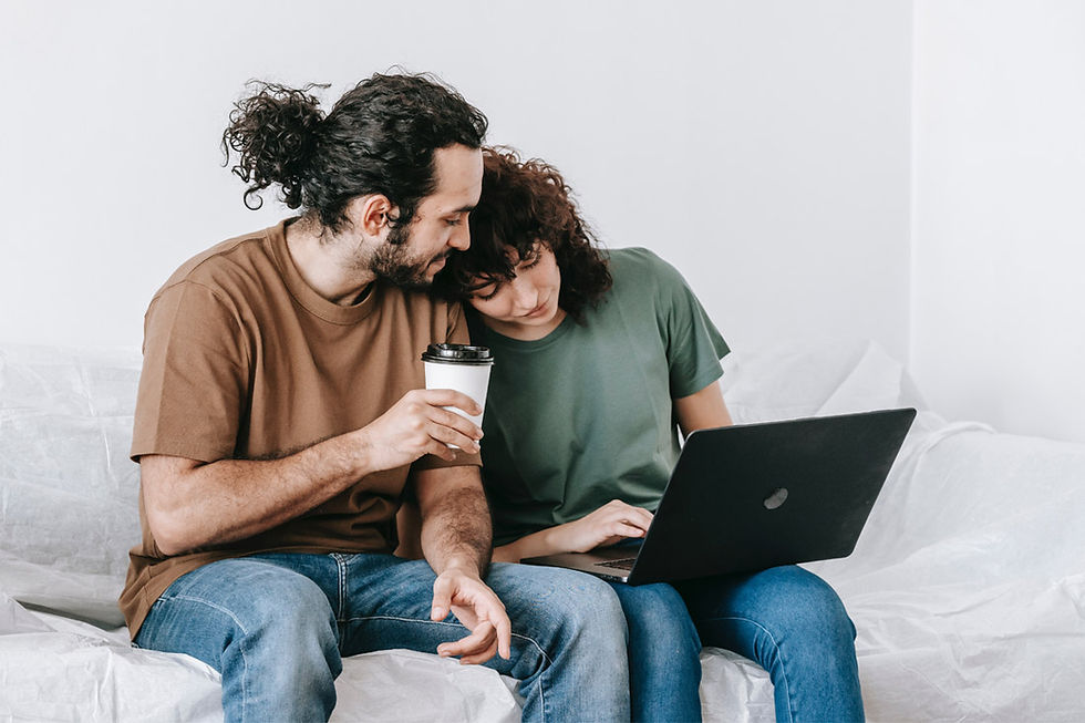 couple sitting down looking at a laptop